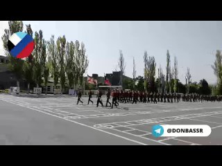 parade in the donetsk military school with stalin's parting words from the great patriotic war.